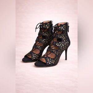 Alaia Black and Gold Cutout Heels